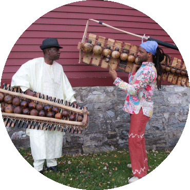 Balla Kouyaté and Matchume Zango pose with their instruments