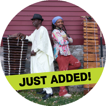 Balla Kouyaté and Matchume Zango pose with their instruments