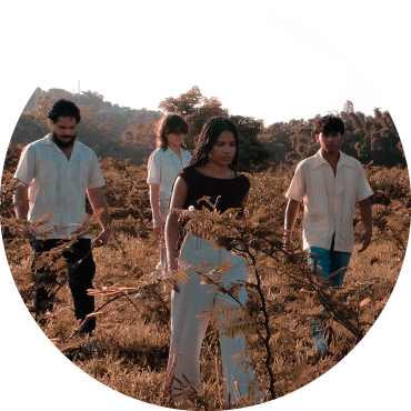 Members of Chuwi walk around in a field.