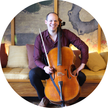 Mike Block sits with his cello.
