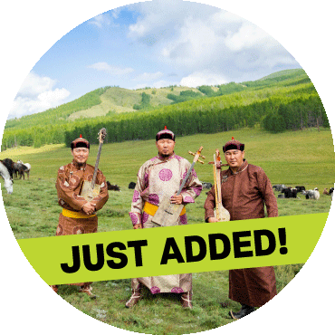 Alash stands together in a field holding their instruments