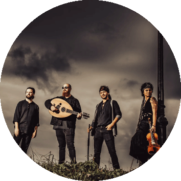 Baklava Express stand and pose with their instruments against a stormy background