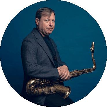 Chris Potter holds a saxophone