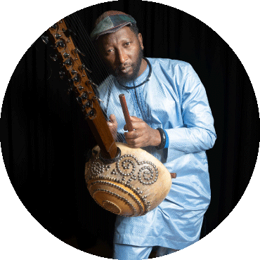 Member of Flamenkora Ali Boulo Santo holds a kora