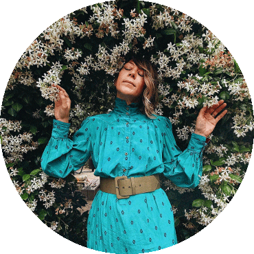 Gretchen Parlato stands surrounded by flowers