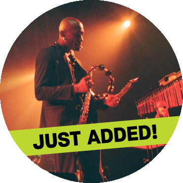 Isaiah Collier holds a tambourine with a 'just added' banner on top of the image