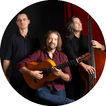 Juanito Pascual Trio poses with their instruments