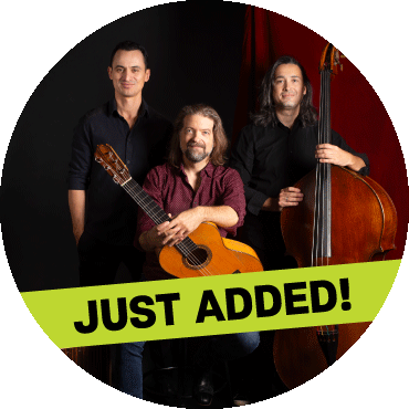 Juanito Pascual Trio poses with their instruments