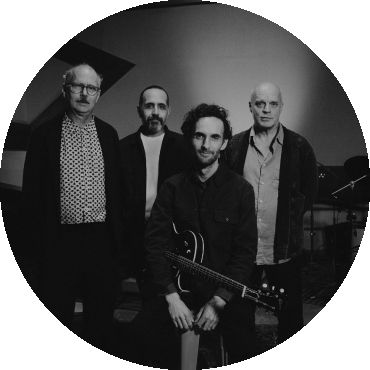 Julian Lage Quartet poses together in a black and white image