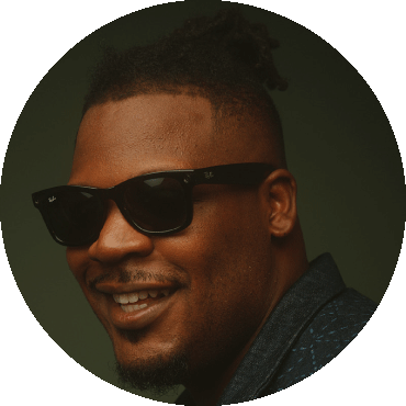 Keyon Harrold smiles with sunglasses on