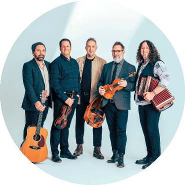 Members of Le Vent Du Nord pose together with their instruments