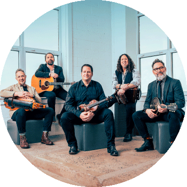 Members of Le Vent Du Nord pose together with their instruments
