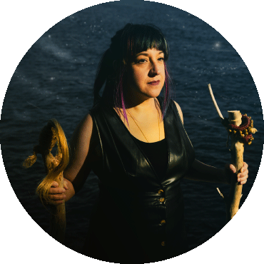 Maria Mazzotta looks to the side