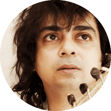 Niladri Kumaar looks to the side