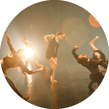 Dancers perform on stage