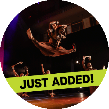 Dancer jumps while performing on stage