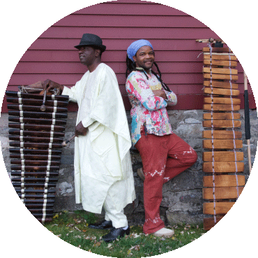Balla Kouyaté and Matchume Zango pose with their instruments