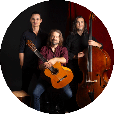 Juanito Pascual Trio poses with their instruments