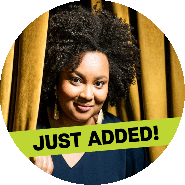 Lucibela poses next to a yellow curtain with a 'just added' banner on top of the image