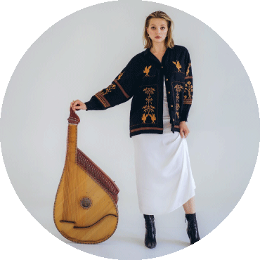 Maryna Krut poses with a bandura