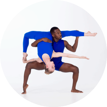 Two dancers in a pose, both wearing electric blue