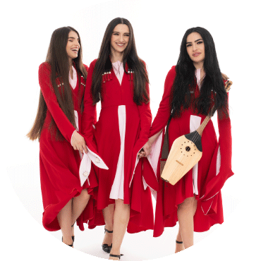 Trio Mandili poses together in matching red outfits while holding a panduri