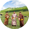 Alash stands together in a field holding their instruments
