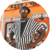 Alune Wade poses with sunglasses on and arms on their hips