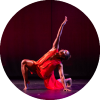 Dancer poses with their leg bent and arm up