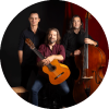 Juanito Pascual Trio poses with their instruments