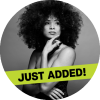 Kandace Springs posing in a black and white image with a "just added" banner