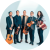 Members of Le Vent Du Nord pose together with their instruments