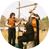 Members of Magic Tuber Stringband play instruments together