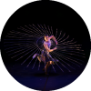 Dancer spins in circle with a lit up object surrounding them