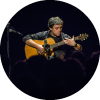 Peppino D'Agostino playing the guitar on stage