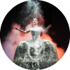 Sasha Velour performs with arms open and a light shining