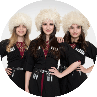 Trio Mandili wear a traditional Georgian hat called a papakha